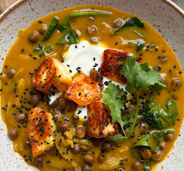 curry of spinach greens and carlin peas served topped with glazed halloumi cheese dice