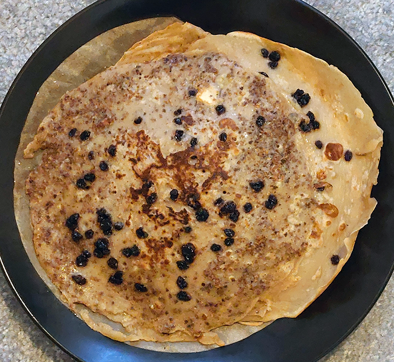 catkin crumb pancake with currants served on a plate