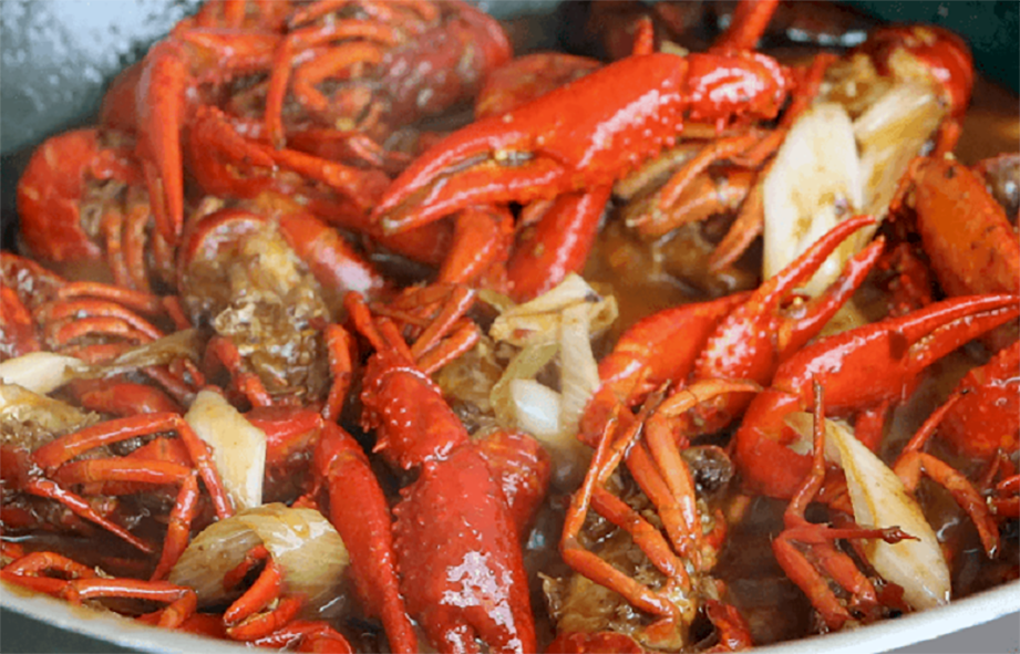 Chinese spicy crayfish cooking in a wok