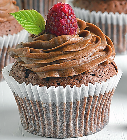 chocolate and raspberry cupcake in a paper case topped with chocolate icing, a raspberry and a mint leaf