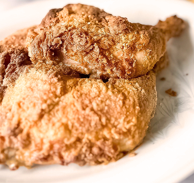 Chicken quarter roasted in a peanut butter and mayonnaise coating
