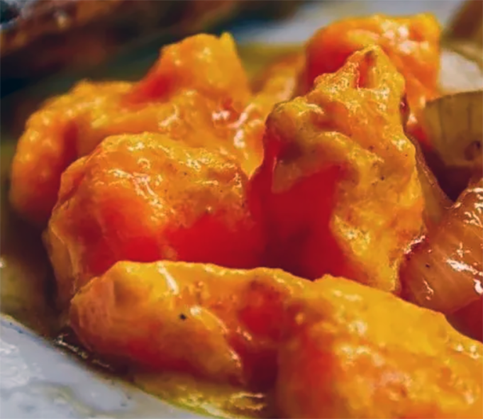 curried papaya salad shown on a plate