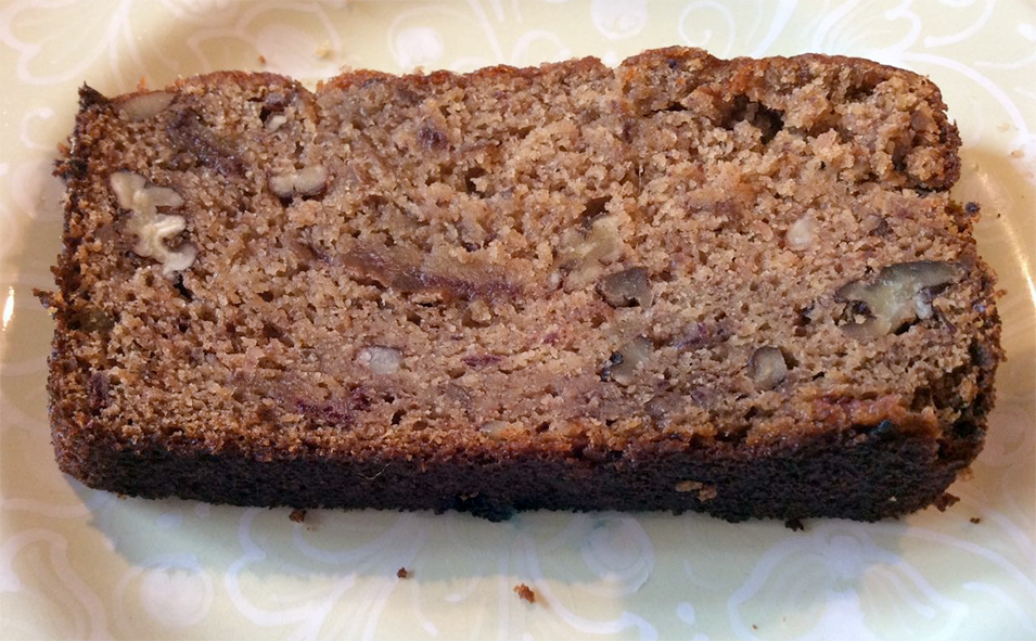slice of data and walnut loaf arranged on a plate