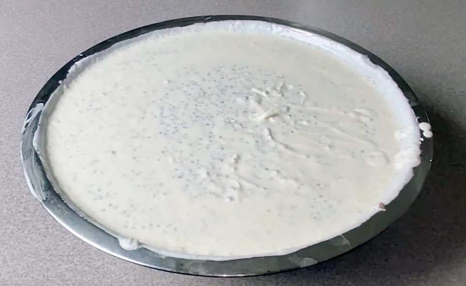 milk, millet, raisins and coconut dessert in a metal bowl