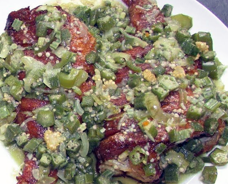 stew of fish with chillies, onion, garlic and okra served on a plate