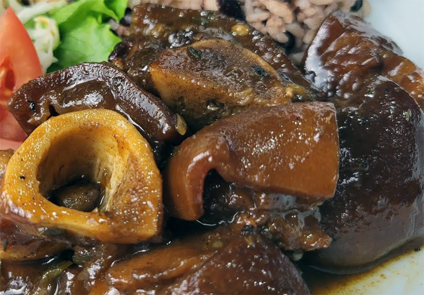 chadian calf foot and vegetable stew on a plate with rice