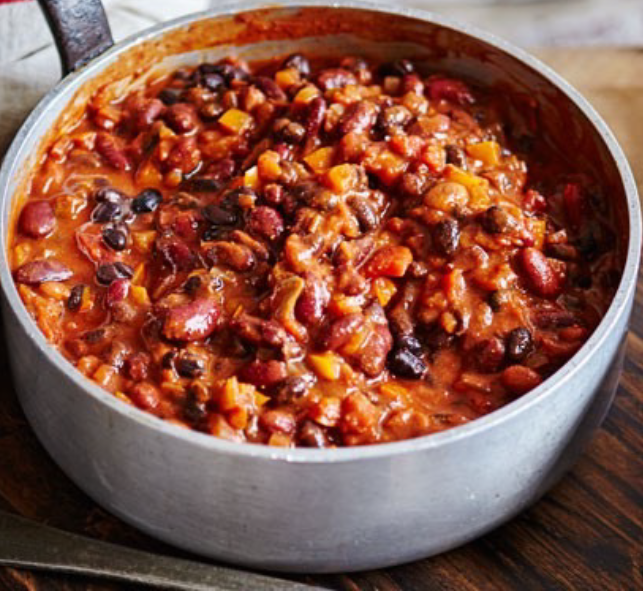 vegetarian chili of pepper and beans in a spiced tomato base shown in a saucepan
