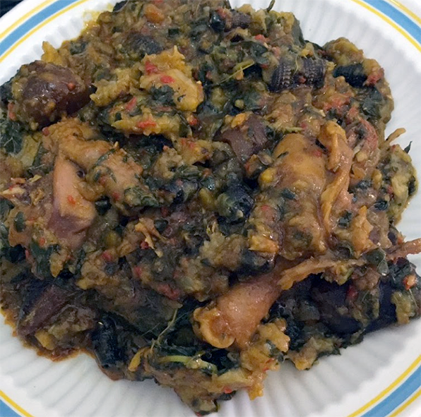 Ekpang nkukwo served on a white paper plate