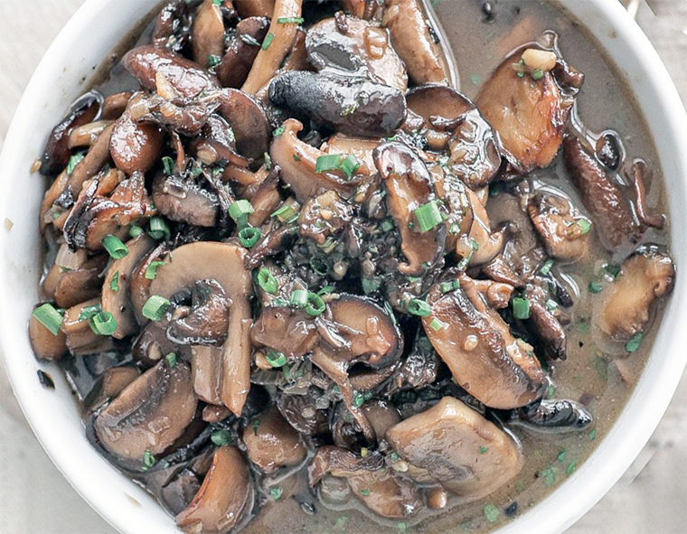 Mushroom sauce presented in a white bowl