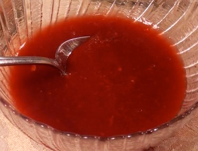 plum sauce presented in a glass bowl