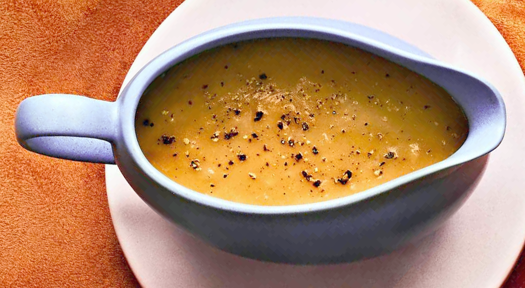 Shallot gravy served in a pale blue gravy boat seen from above