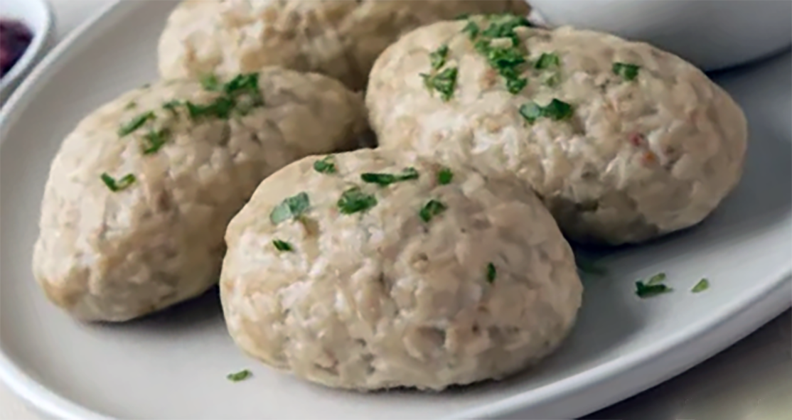 quenelles of gefilte fish on a plate