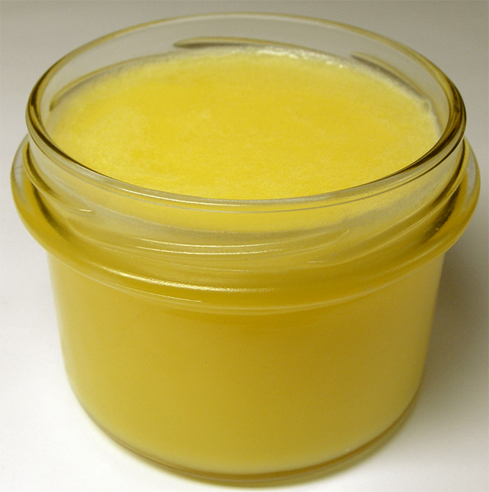 Ghee, clarified butter, in a glass jar