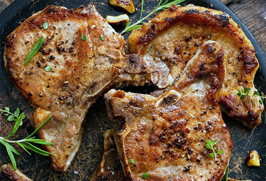 Marinated and barbecued pork chops served on a plate