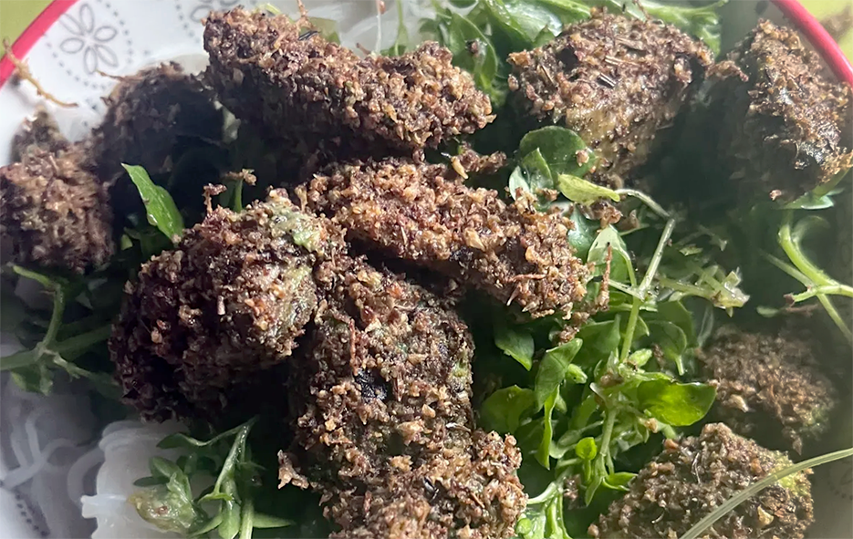 Avocado pieces coated in fried spiced hazel or beech catkin pollen capsules