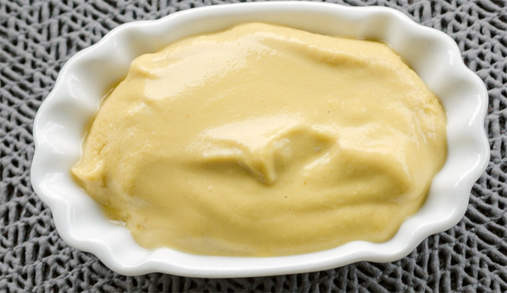 home-made American style mustard in a small oval dish
