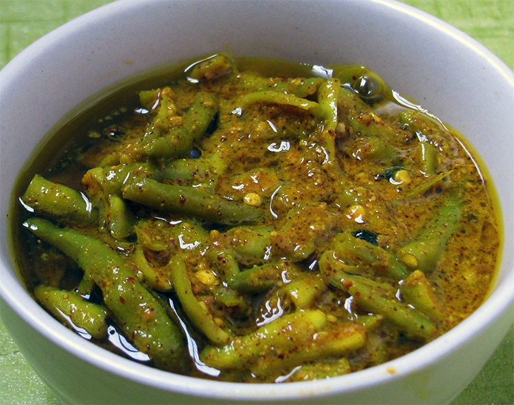 Indian quick pickle of green chillies in a white bowl