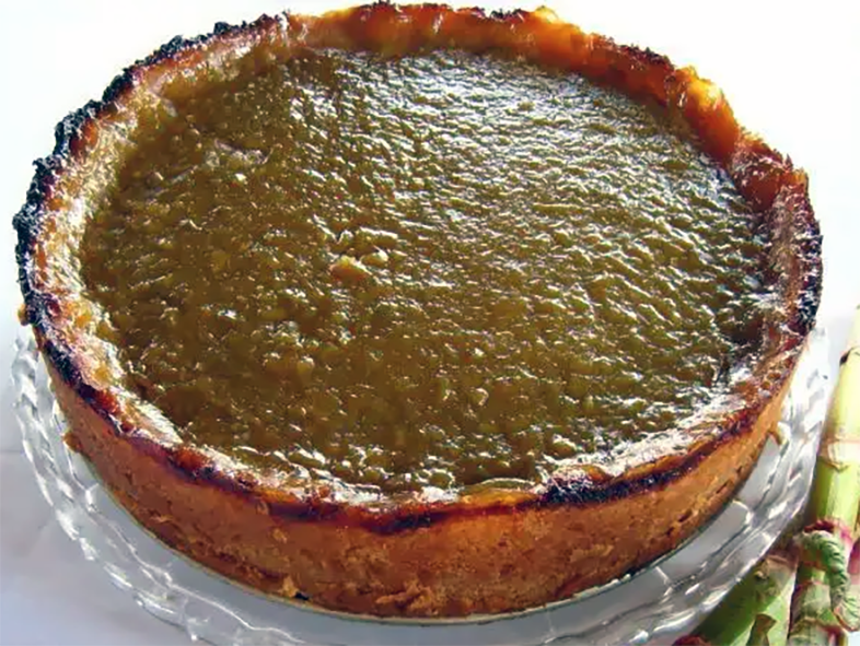 Japanese knotweed and sorrel tart on a glass cake stand