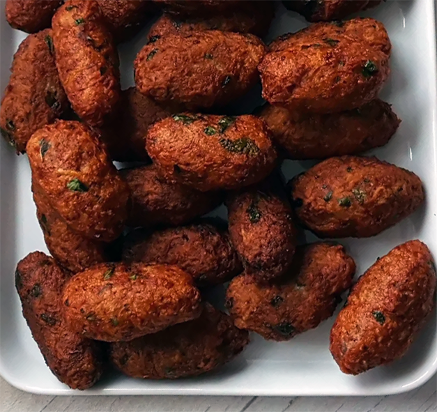 cypriot style lamb keftedes on a white plate