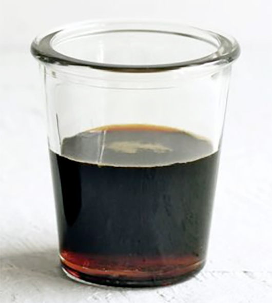 Ketjap Manis in a shot glass