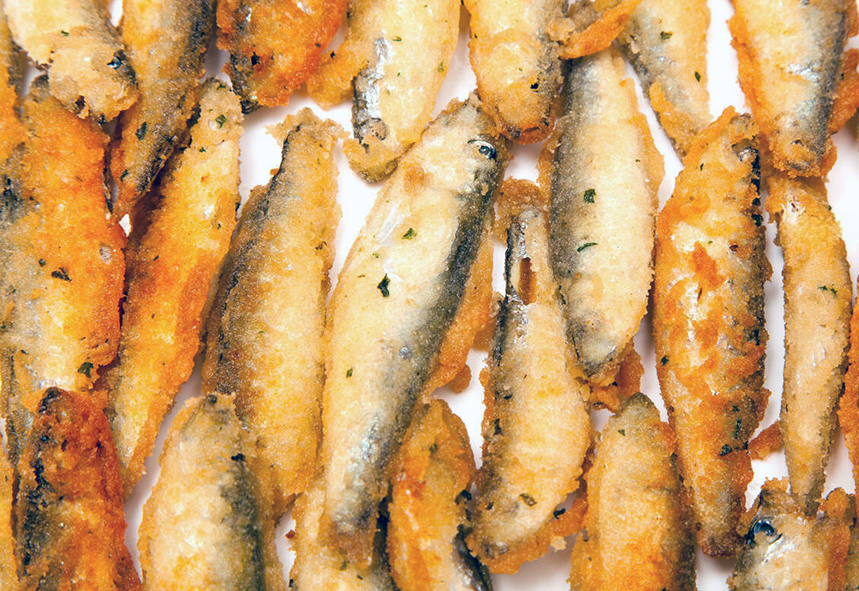 battered kiel sprats against a white background