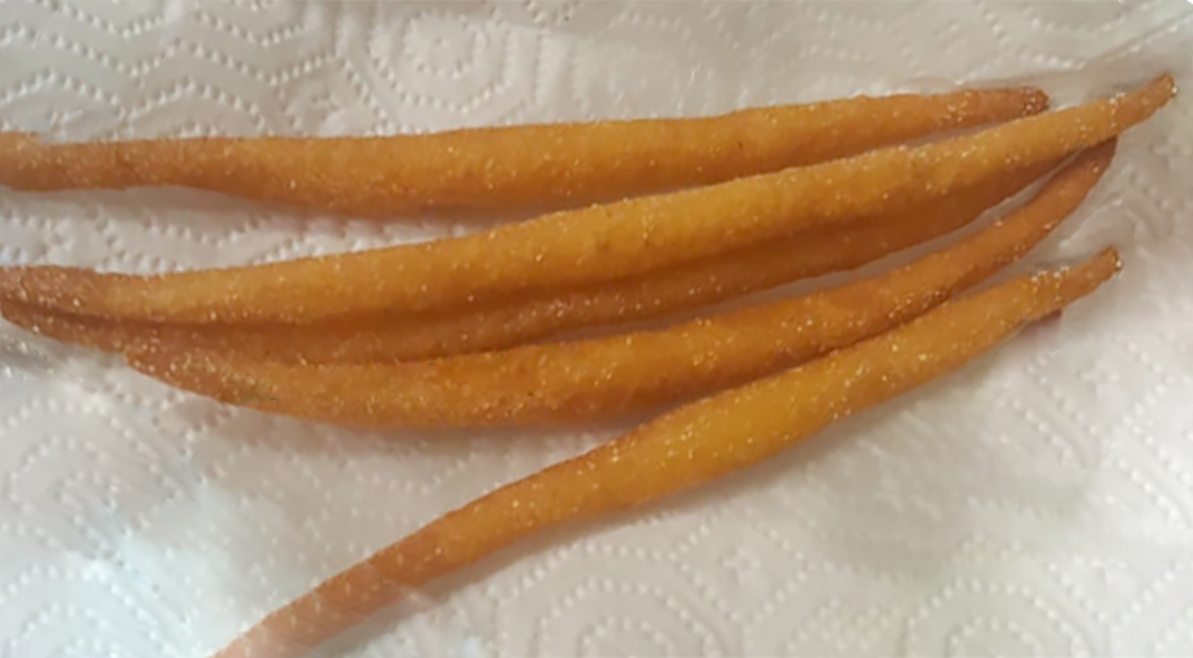 Nigerian kokoro, cornmeal sticks arranged on kitchen paper