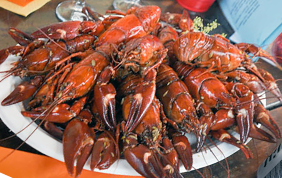 pile of cooked crayfish arranged on a serving platter