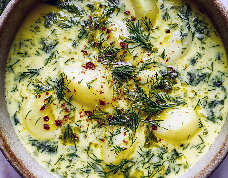 potato, sorrel and parsley soup in a yoghurt and egg base served garnished with dill