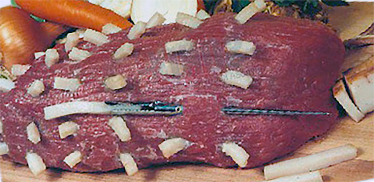 Beef larded with a larding needle