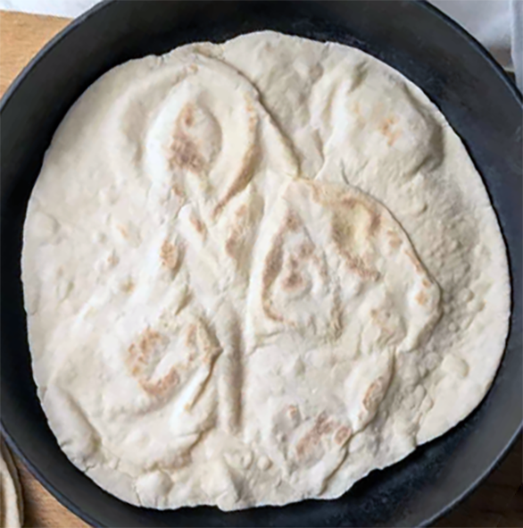 Lavash, leavened Turkish flatbread in a skillet</a>
