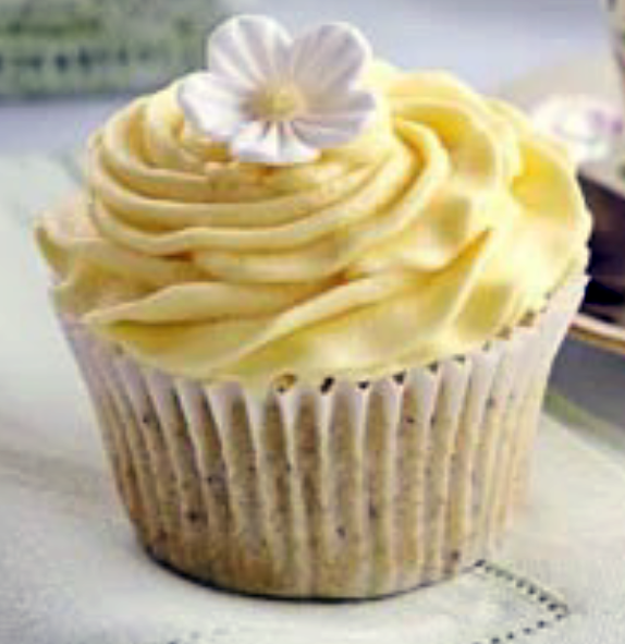 lemon poppyseed cupcake with yellow lemon juice icing and a candy flower for decoration