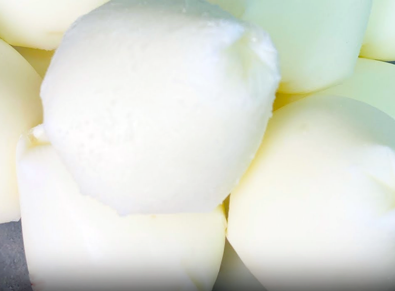 frozen balls of sour milk piled on a plate