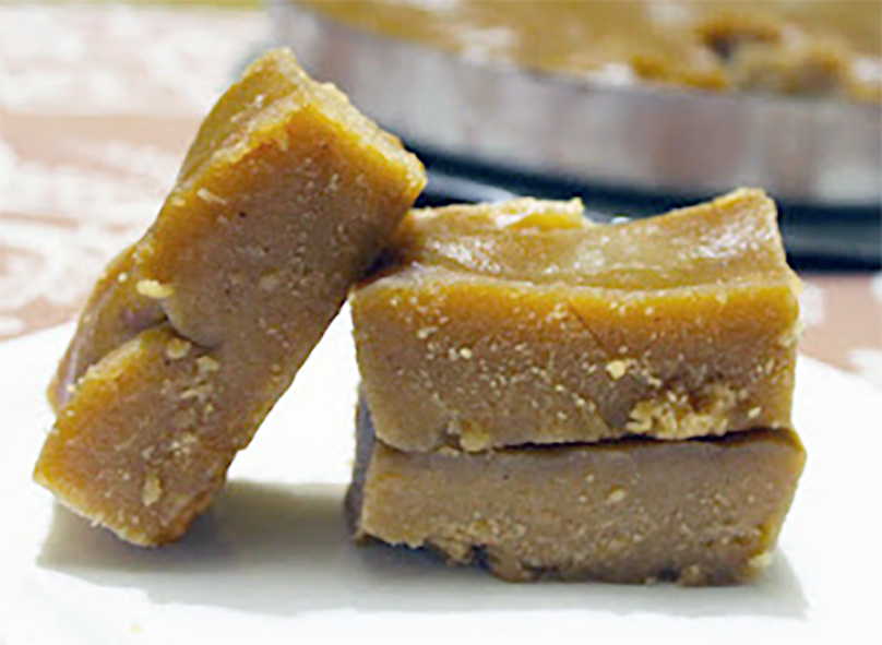 three pieces of mandas piled up on a plate