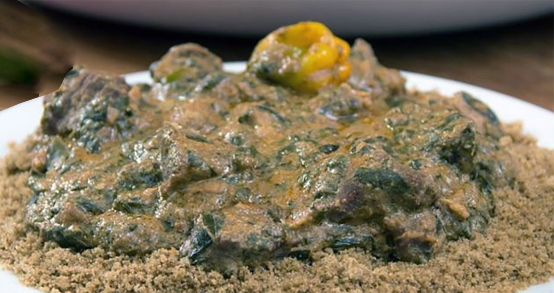 eat and cassava leaf stew in a peanut base with habanero chillies on a bed of millet couscous