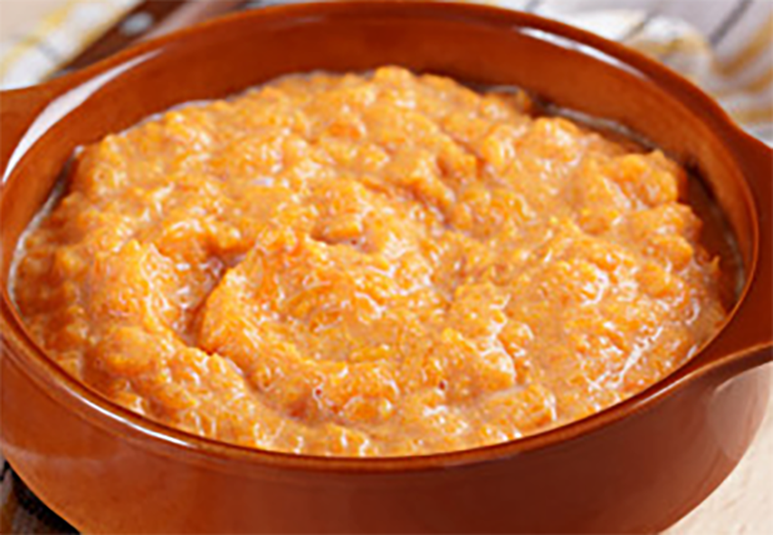 millet and pumpkin kasha, porridge, in an earthenware bowl