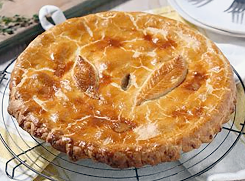mushroom and spinach rustic pie baked in a flan dish