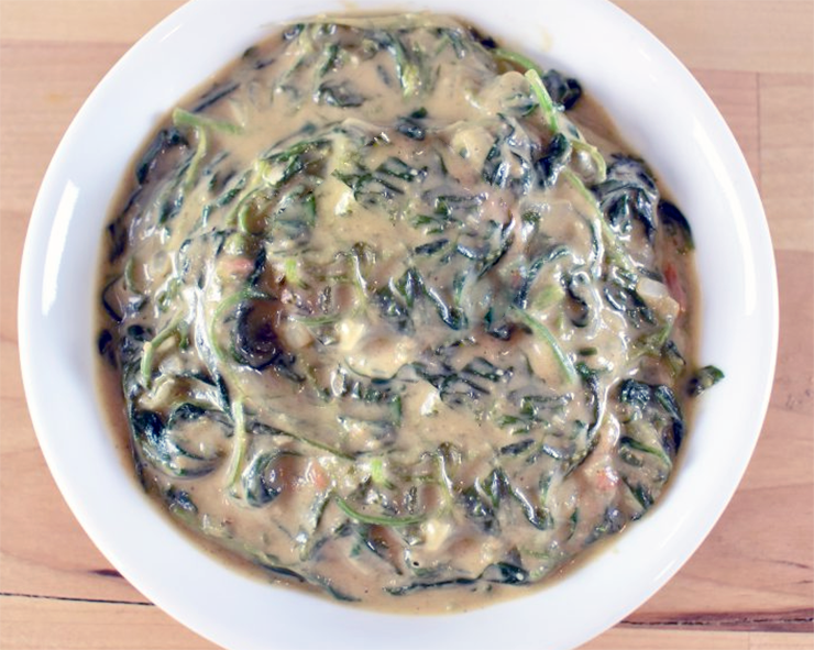 image of an African-style peanut stew made with wild nettle greens, British-West African fusion dish.