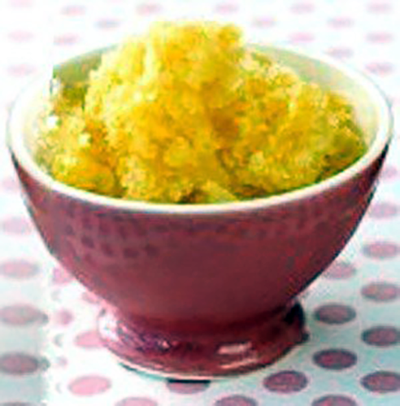 orange granita arranged in a red bowl