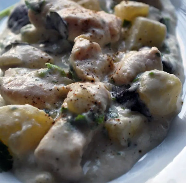 Ossetian chicken and potatoes cooked in sour cream served on a plate
