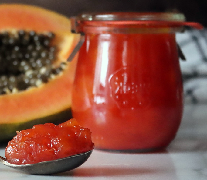 papaya nectar preserve in a jar and on a spoon