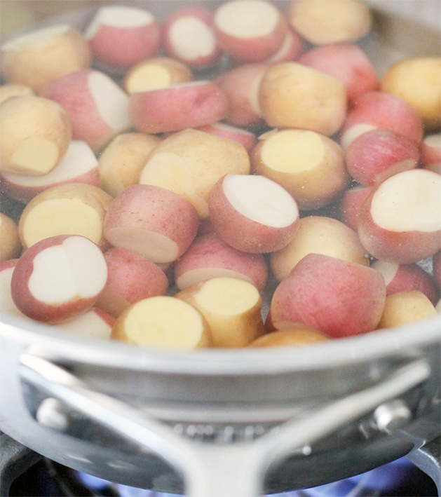 Parboiling potatoes in a pan