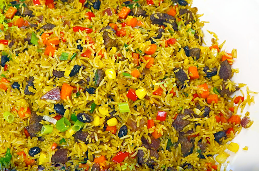 rice blended with beef and vegetables, party beef fried rice, served on a plate