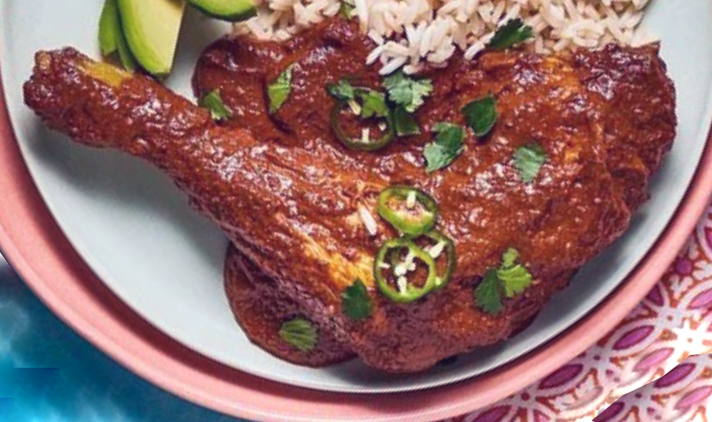 Pasilla mole sauce served over a chicken leg