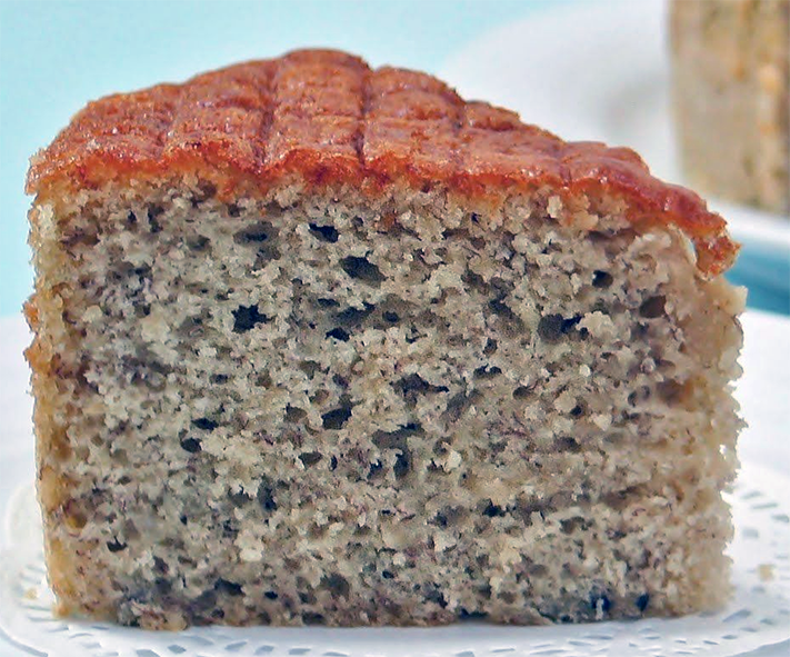 wedge of banana sponge cake on a doily