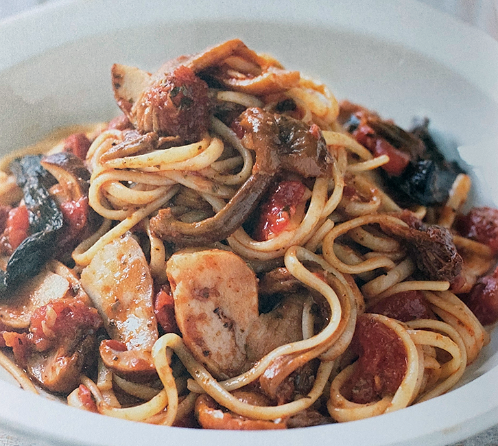 Spaghetti with mixed wild mushroom sauce served in a pasta bowl