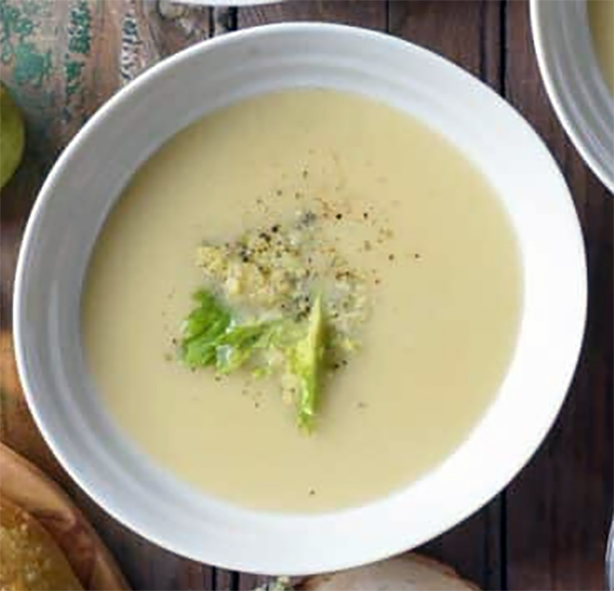 pear and stilton soup with bergamot served garnished with celery leaf and stilton
