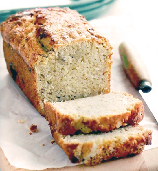 loaf of Philippines banana bread with two slices cut from the loaf and arranged in front</a>