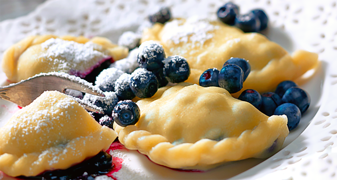 polish bilberry dumplings served on a plate with bilberries