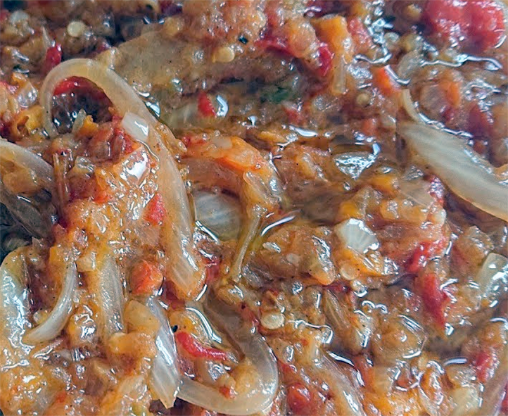 sauce of chillies and onions in a tomato base with Dijon mustard on a plate