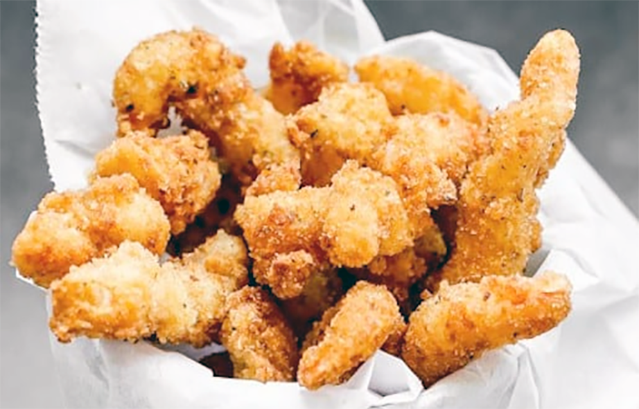 popcorn shrimp/prawns served in a napkin
